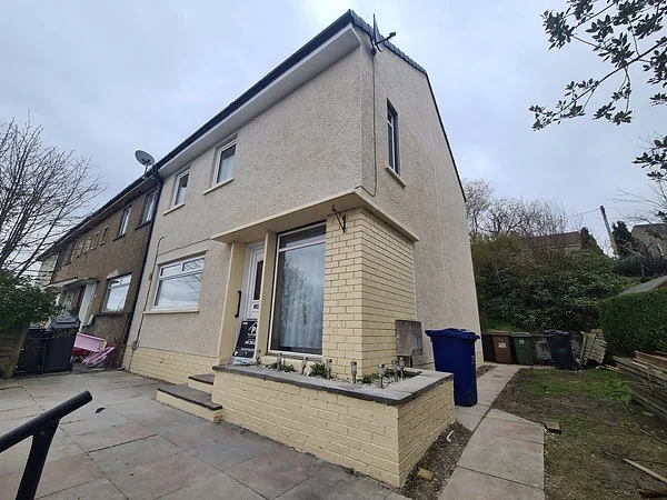 Light textured exterior finish across a house elevation